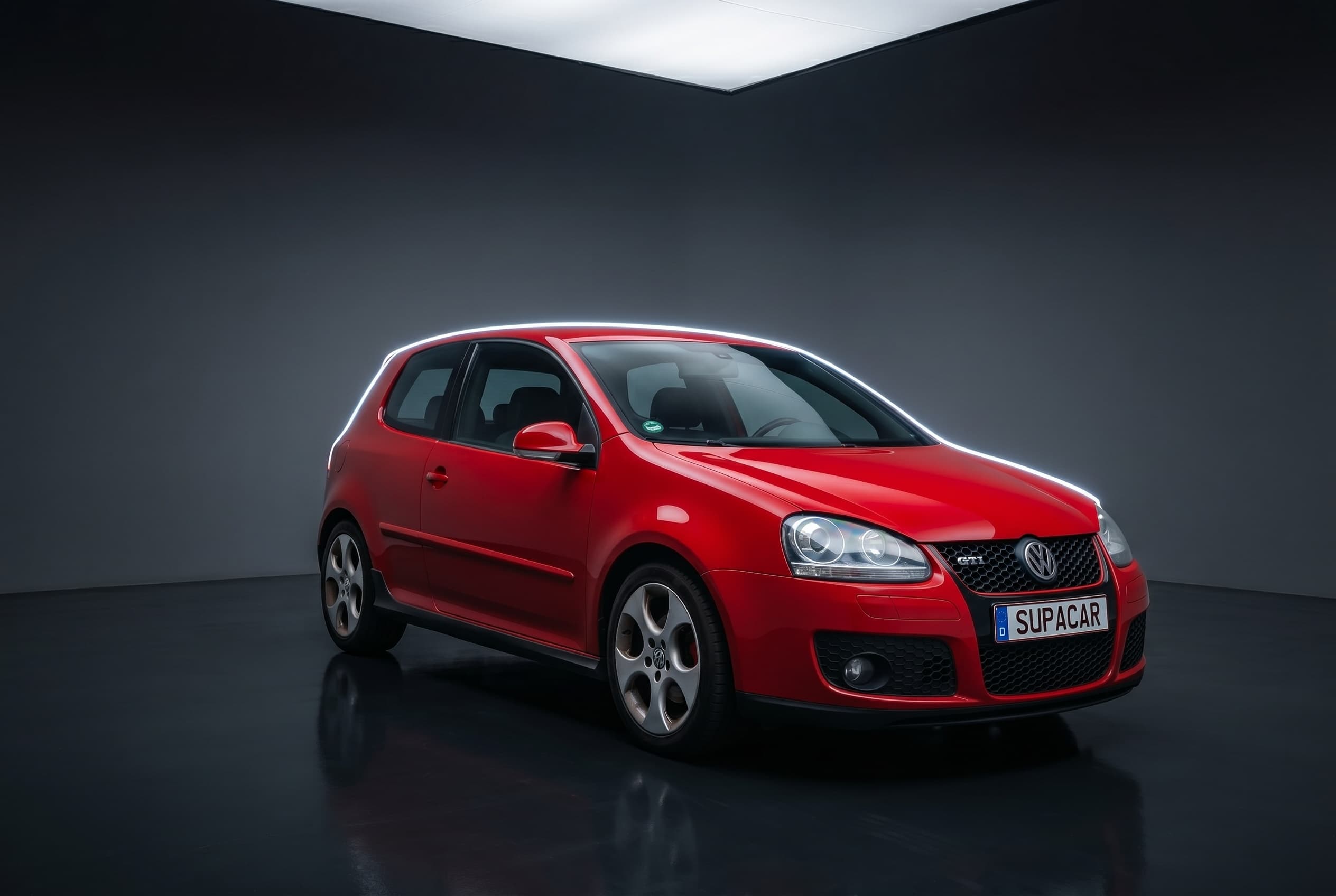 Car photographed in a dark studio scene